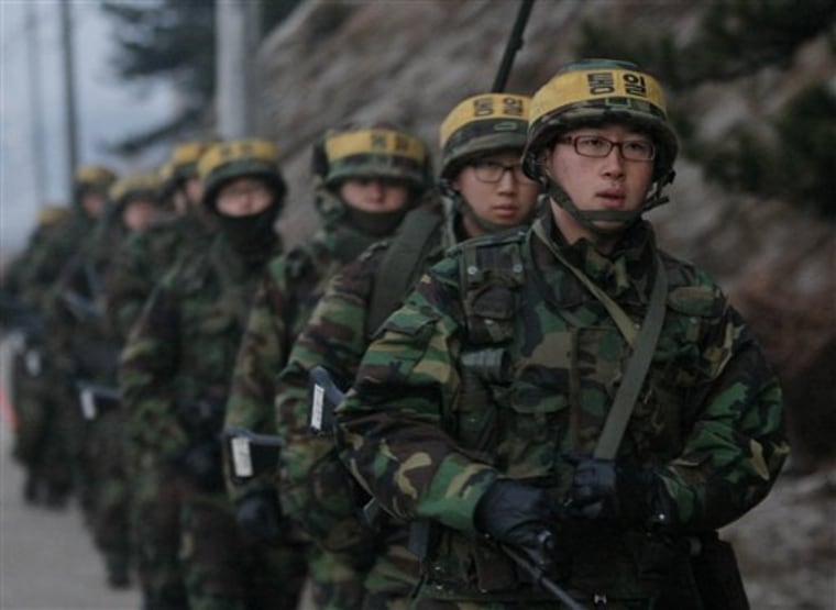 South Korean marines patrol along on Yeonpyeong island, Tuesday, Dec. 21. 